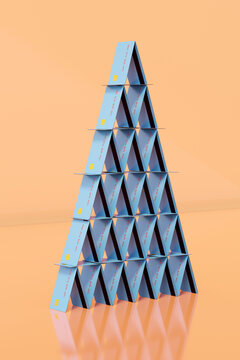 Blue credit / debit house of cards / pyramid. Debt / payment concept