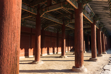 Traditional red columns of the architecture in the palace in Seoul