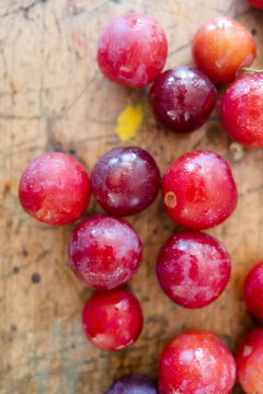 fresh plums on wooden table
