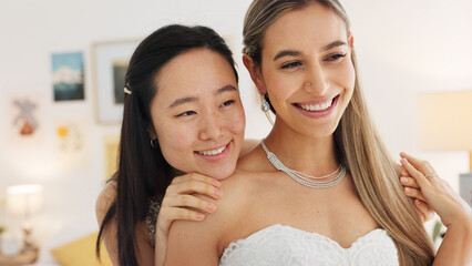 Wedding, bride and bridesmaid looking happy, proud and excited share hug, joy and love wearing white dress and ready for ceremony. Interacial asian woman and friend laughing waiting for a celebration - obrazy, fototapety, plakaty
