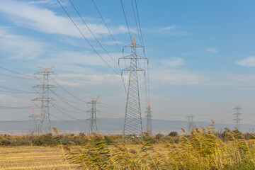 Obraz premium Gray power line is on the blue sky background
