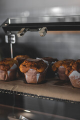 Muffins on display in a café