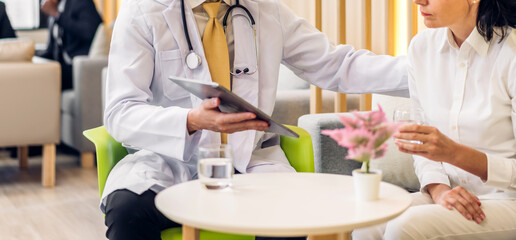 Man doctor wearing uniform with stethoscope service help support discussing and consulting talk to sick senior woman patient about checkup result information in hospital.healthcare and medicine