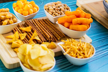 Party food. Salty snacks served as party food in bowls
