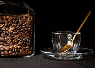 Coffe beans and beautiful cups made of glass.
