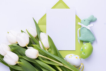 Template for Easter greeting card. Blank card with an envelope and bouquet of white tulips
