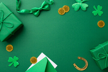 Saint Patrick's Day concept. Top view photo of gift boxes gold coins bow-tie horseshoe envelope...