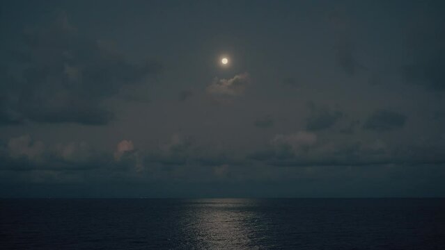 Full moon light reflect on thailand's ocean with Clouds at  wide angle (Shot at Koh Samet)
