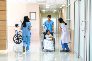 Fototapeta premium Asian smiling woman doctor service help support discussing and consulting talk to little girl patient give teddy bear and check up information in hospital