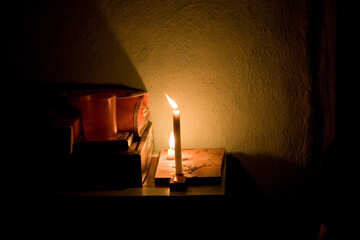burning candles in the fireplace