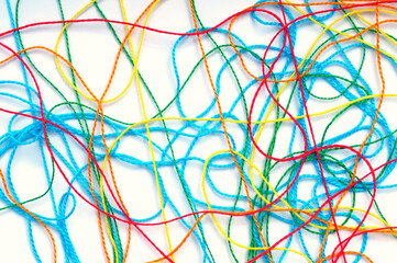 Tangled colorful threads on a white background - obrazy, fototapety, plakaty