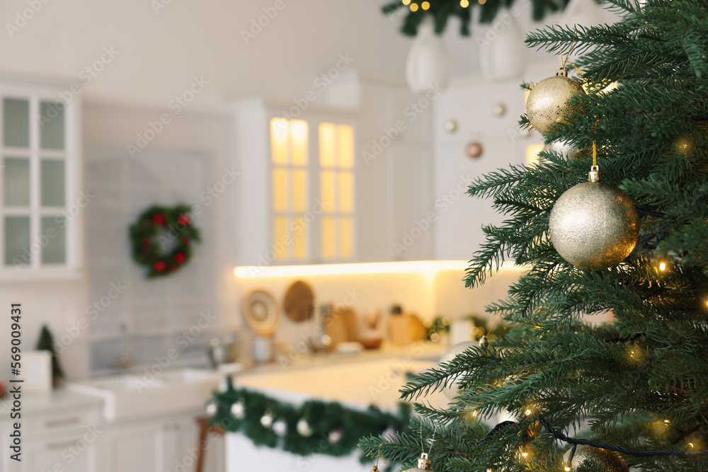 Sticker Closeup view of beautiful decorated Christmas tree in kitchen. Space for text