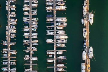 Aerial view of boat Marina. Fishing and sport boats in marina from above.