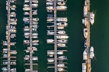 Fotobehang Aerial view of boat Marina. Fishing and sport boats in marina from above. © KennyOPhoto