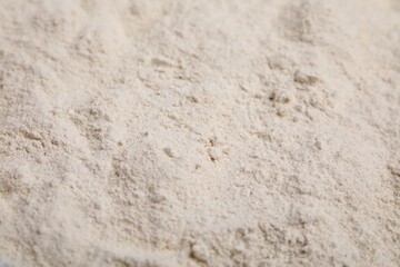 Pile of quinoa flour as background, closeup