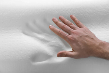 Man with orthopedic memory foam pillow, above view