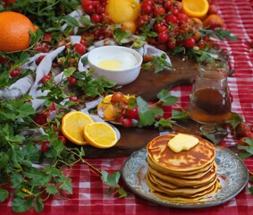 Fototapeta na wymiar pancakes with honey and tea on a white plate. top view.