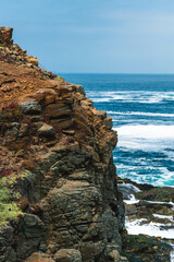 rock cliff in Puquen National Park near valparaiso in Chile., Latinoamerica, Southamerica. Its a long treeking where you can find a cold geyser made from a natural formation in the sea.