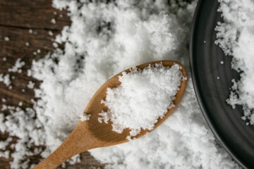 sea salt in a wooden background.
