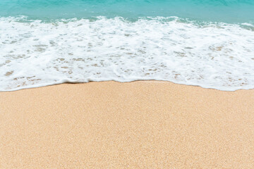 Fototapeta na wymiar Sandy beach with azure sea and a place to test.
