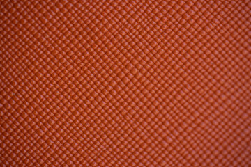 acercamiento de textura de pl&aacute;stico naranja con textura de bolitas