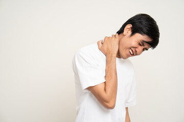 Young Asian man has problem with structural posture He had neck and shoulder pain. Massaged his neck and shoulders for relief. reduce muscle tension. Standing on isolated white background