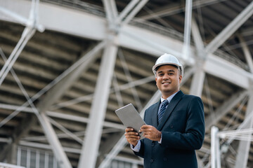 Businessman manager owner real estate working with digital tablet at modern office building. Cooperation of architect designer. Engineer with safety helmet checking at working construction site