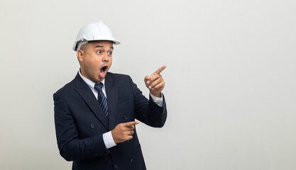 Businessman manager owner real estate pointing finger on isolated white background. Cooperation of architect designer. Engineer with safety helmet checking at working construction site