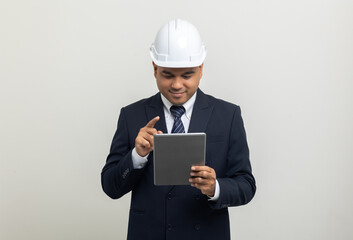 Businessman manager owner real estate working with digital tablet on isolated white background. Cooperation of architect designer. Engineer with safety helmet checking at working construction site