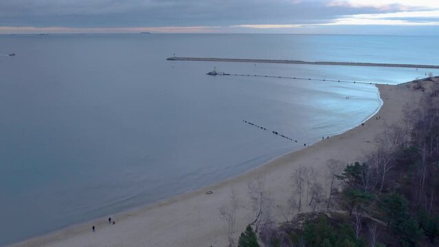 Aerial View Of Calm Sea, Stogi Nudist Beach And Seawall In Sunrise In Gdansk, Poland. - descend