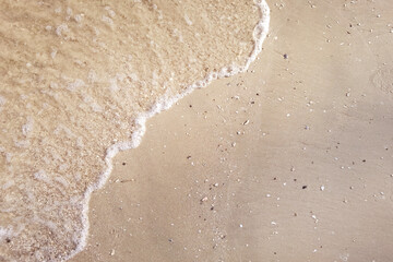 Wave of the sea on the sand beach