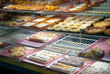 Bakery case of fresh baked goods in a bakery.