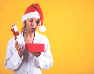 person in santa hat holding a gift