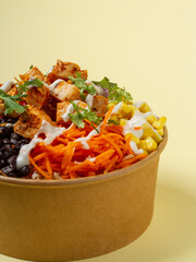brown rice, cajun chicken, tomato, corn, black beans, carrots, onion, cilantro, and greek yogurt ranch dressing