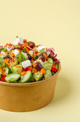 quinoa, lettuce, kalamata olives, feta cheese, roasted pepper, tomato, cilantro, onion, almond flakes, and roasted pepper sauce