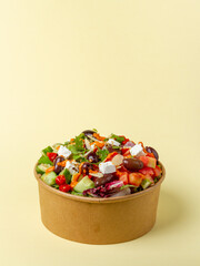 quinoa, lettuce, kalamata olives, feta cheese, roasted pepper, tomato, cilantro, onion, almond flakes, and roasted pepper sauce