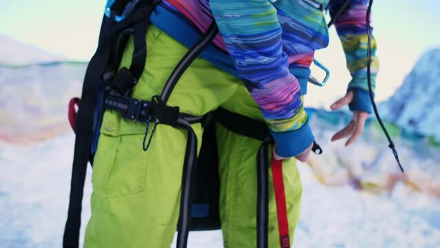 paraglider preparing paraglider equipment with help