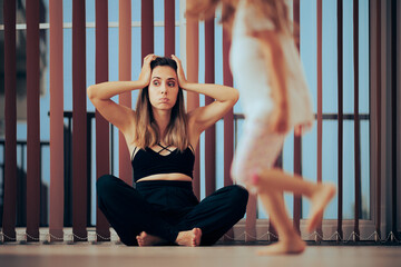 Stressed Mom Trying to Exercise on the Floor at Home. Unhappy mother trying to find time for a...