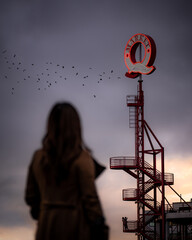 silhouette of girl looking at a couple