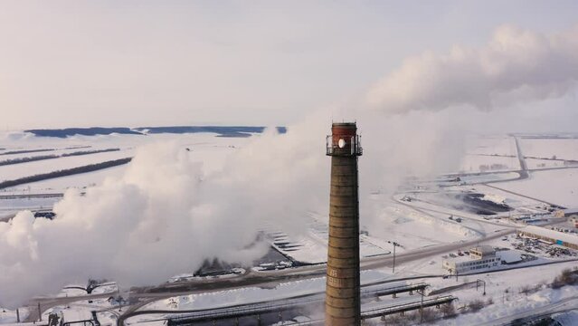 Aerial view of steam from the chimney of a sugar factory