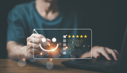 Close up Man hand give five star symbol on virtual screen to increase rating of product and service concept, Customer service and business satisfaction survey,selective focus.