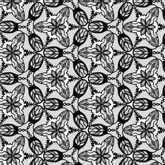 abstract black and white flower and leaf pattern background, decoration fabric and ethnic wallpaper ornament.