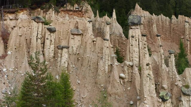 Aerial orbit around the Earth pyramids of Platten in Italy. Beautiful drone shot.