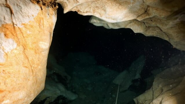 Budapest - 17 August 2017: Technical diver in red flippers in the underwater cave of Budapest