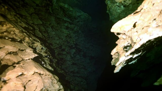 Budapest - 17 August 2017: Technical diver in red flippers in the underwater cave of Budapest