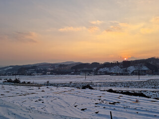 Fototapeta na wymiar Rural winter landscape at sunset
