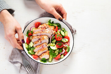 Salad with chicken meat. Fresh vegetable salad with chicken breast. Meat salad with chicken fillet and fresh vegetables on plate.