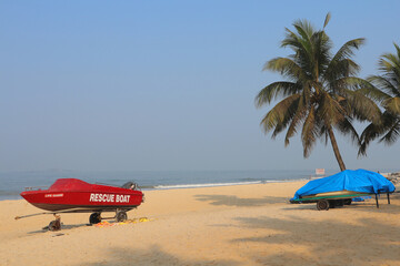 View of Malpi beach with a lifeboat in Karnataka, India.