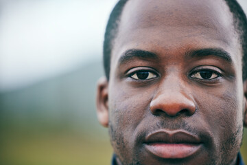 Portrait, sports and coach by man on a field for fitness, exercise and training with blurred background mock up. Face, mindset and personal trainer outdoors for workout, performance and match
