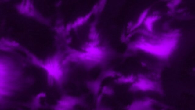 Background with glowing iridescent plasma pattern. Motion. Colored liquid plasma pattern on black background. Moving patterns in plasma fluid